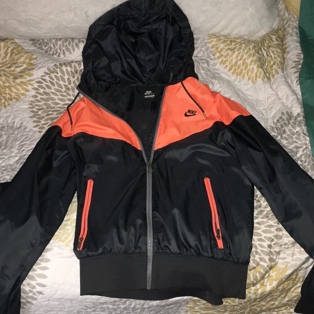 black and orange Nike wind breaker